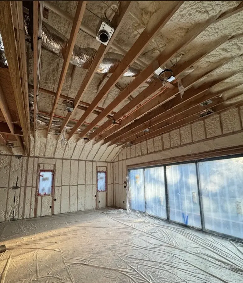 Interior walls and ceiling insulated with spray foam during new construction in Warrington
